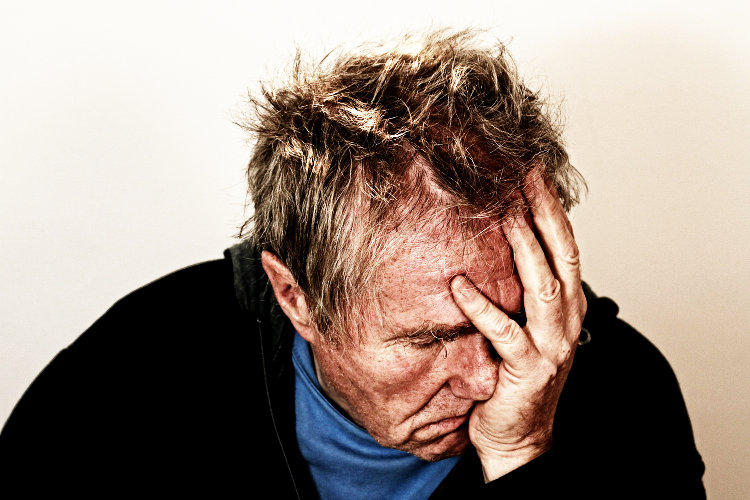 Man with head in hands