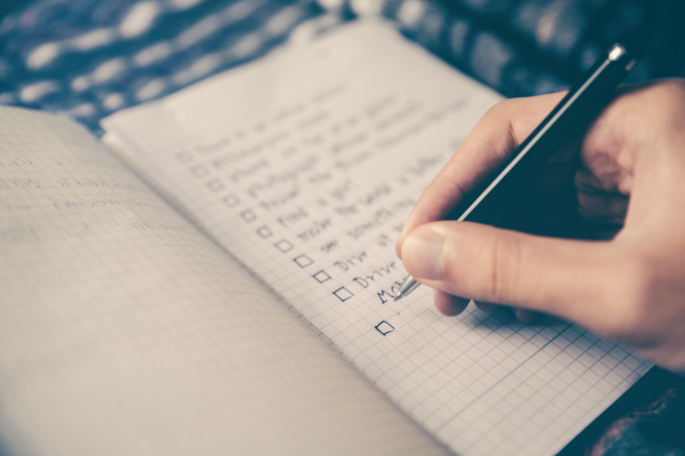 Writing goals in a notebook