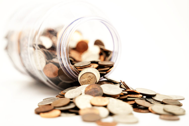 Coin jar spilling coins